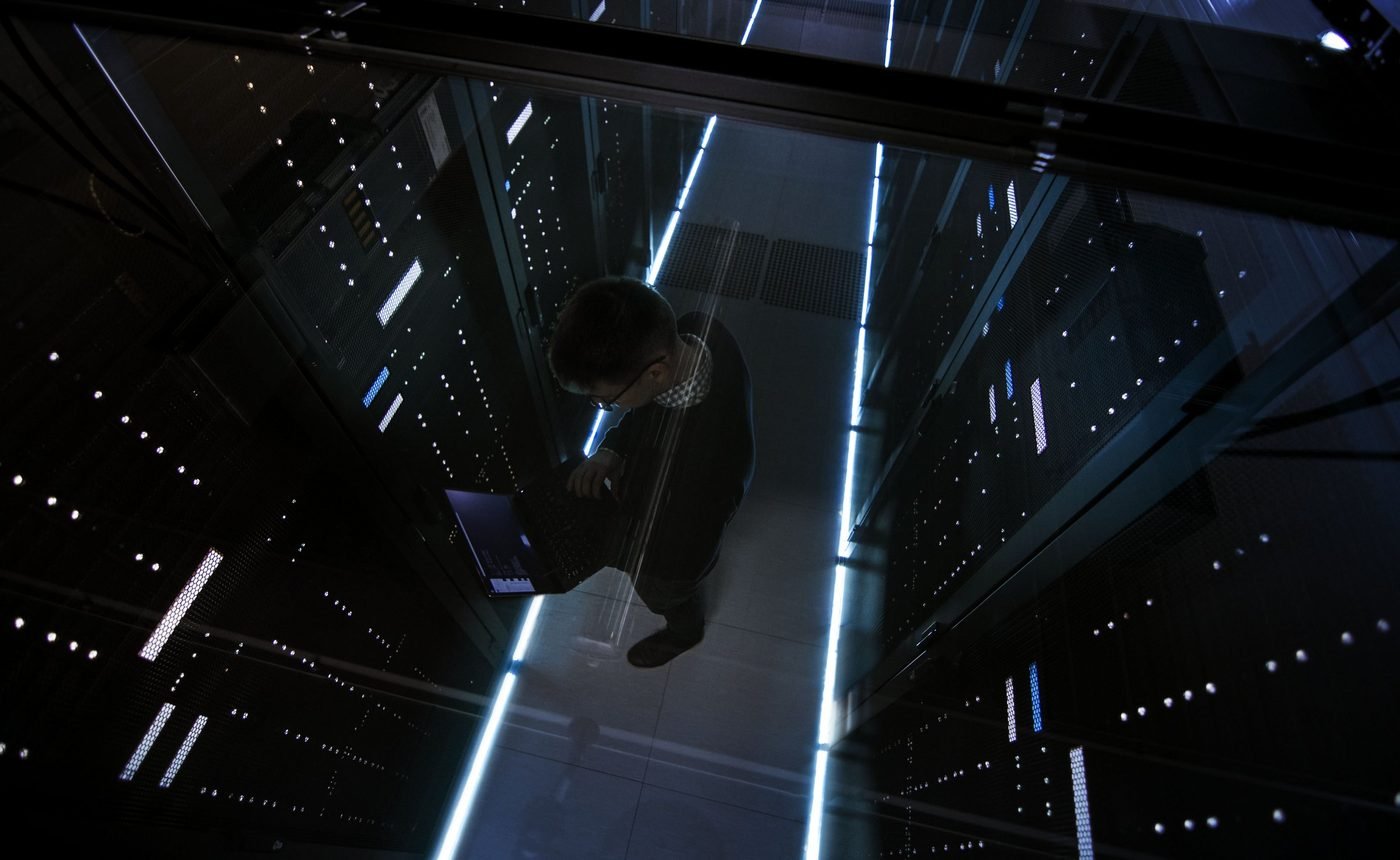Dark rack room with blue light lines